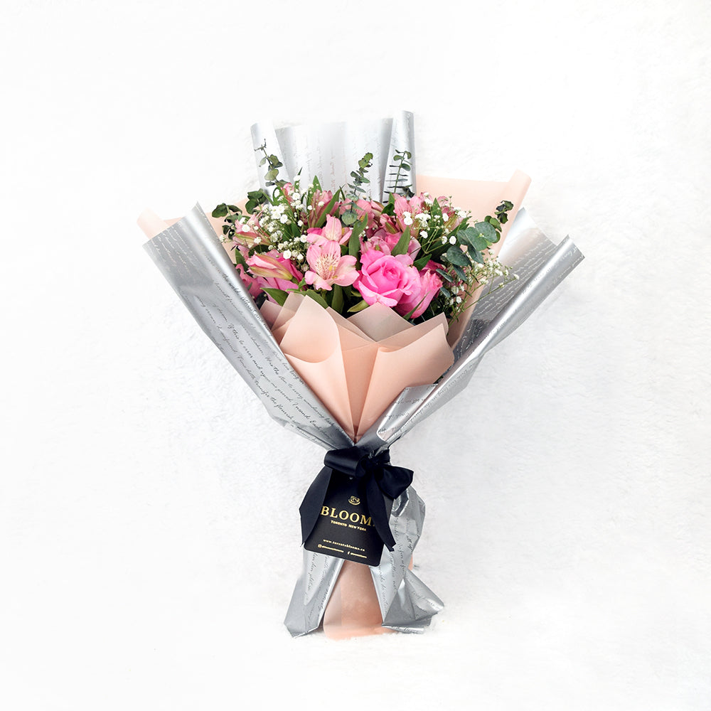 Pink and Light Pink Rose Bouquet Presented with Sparkling Wine Bottle – how the gift is presented