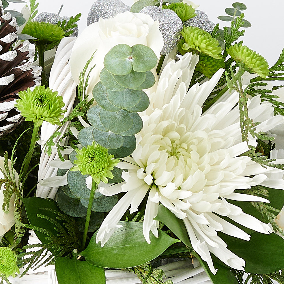 Refined Holiday Floral Basket Featuring White Roses and Chrysanthemums – how the gift is presented