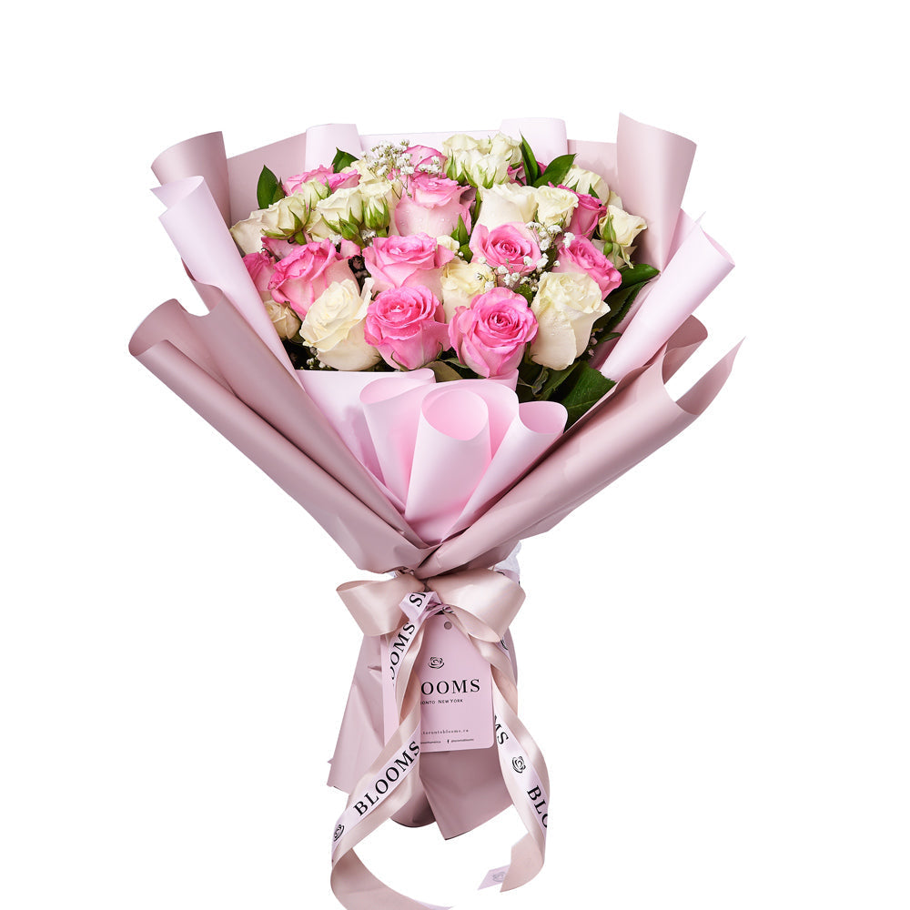 Wrapped Bouquet of Pink Roses and White Baby's Breath – how the gift is presented