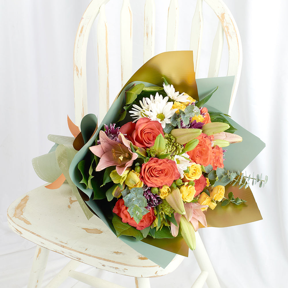 Mixed floral rose and lily bouquet. Blooms America Delivery.