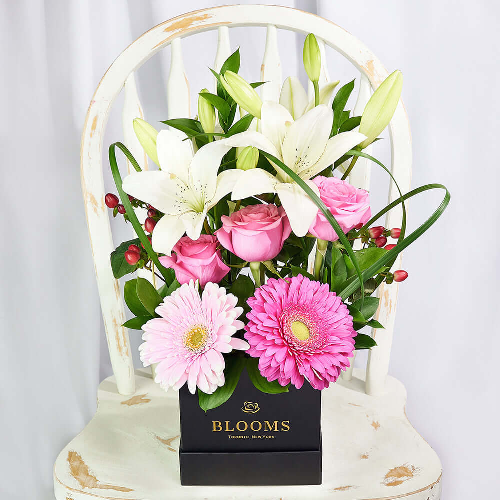 Black Hat Box Floral Arrangement with Gerberas and Roses – how the gift is presented