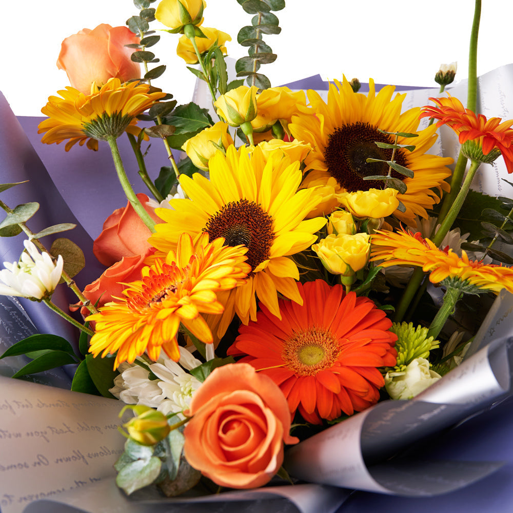 Seasonal Sunflower and Rose Bouquet with Gerbera Accents – how the gift is presented