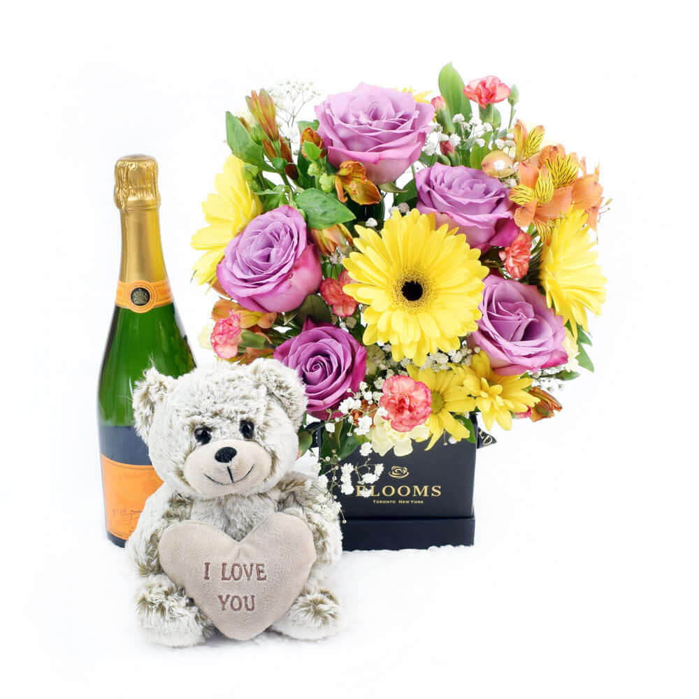 Sparkling Wine Gift with Mixed Flower Arrangement and Grey Teddy Bear – how the gift is presented