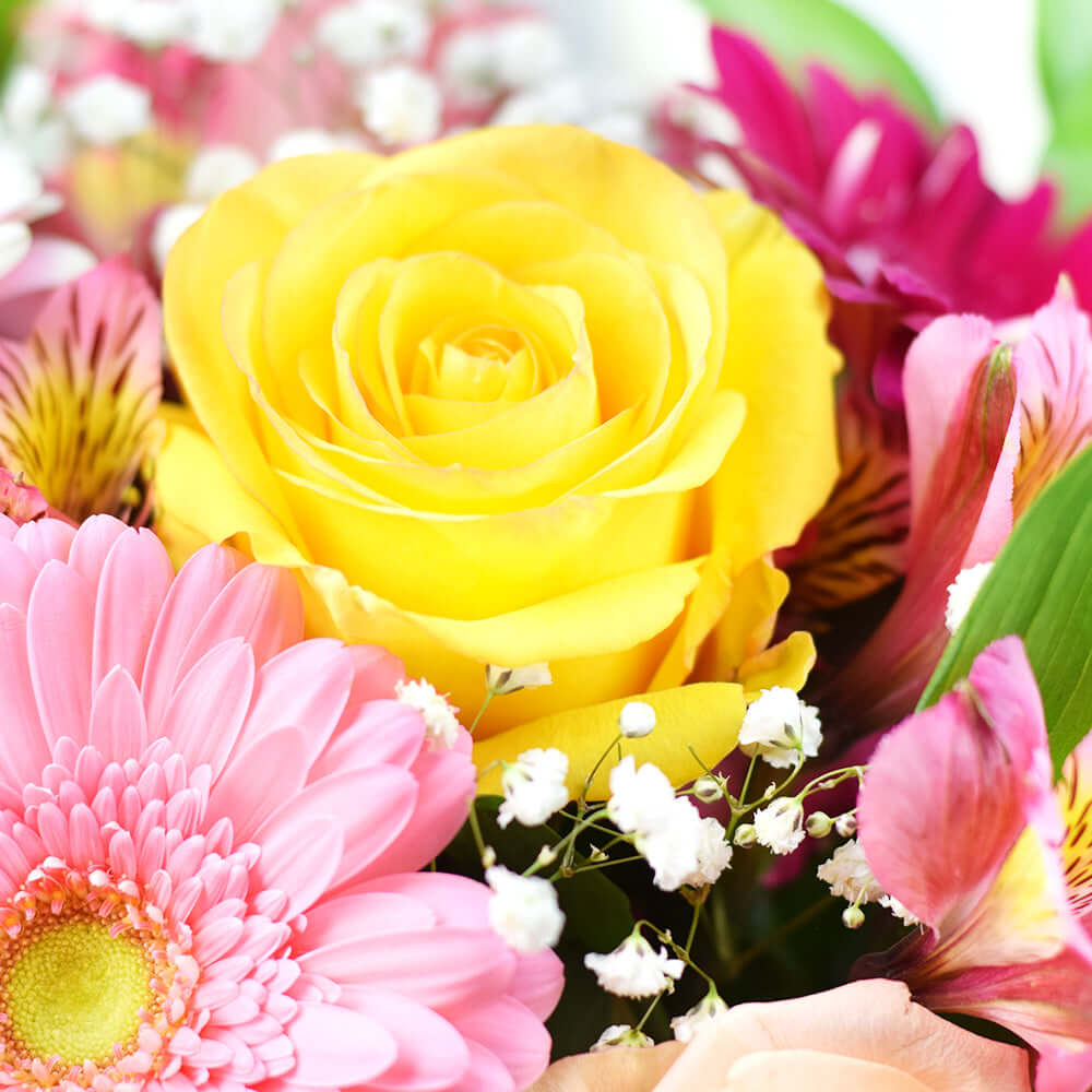 Warm Hued Mixed Flower Box Arrangement in Black Hat Box – how the gift is presented