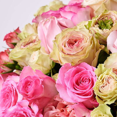 This large floral gift features pink and white roses gathered into a pink hat box for a wonderful way to breath of spring in any space.. Blooms America Delivery