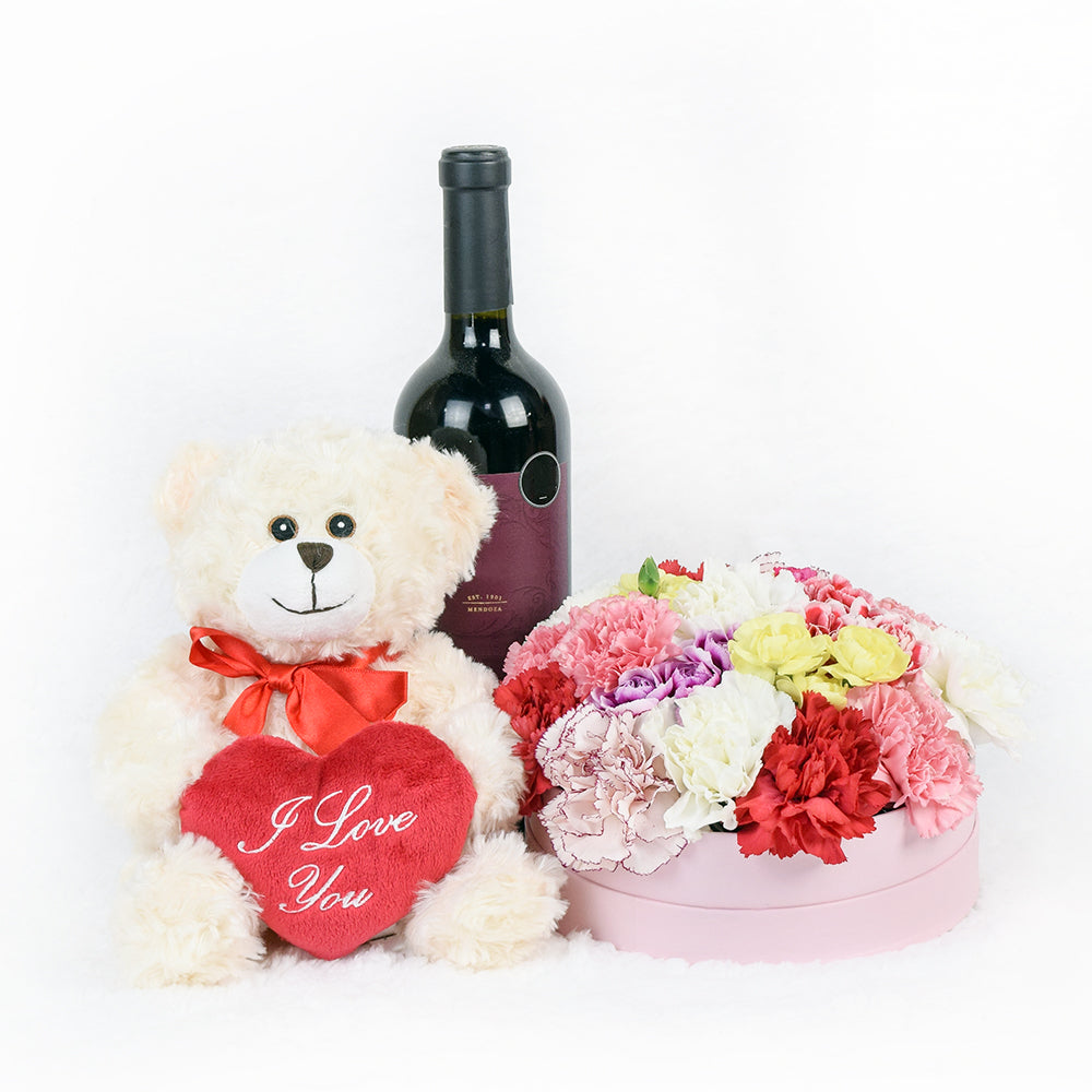 Deluxe Carnations in Pink Hat Box with Bottle of Red Wine – how the gift is presented