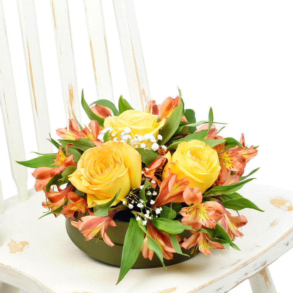 Autumnal floral hat box arrangement in yellows and oranges, from America Blooms - America Delivery.