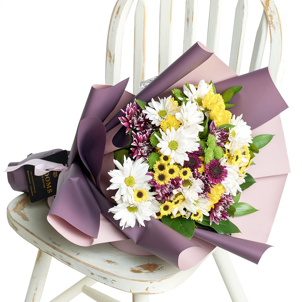 Multi-coloured mixed daisy bouquet. Blooms America Delivery.