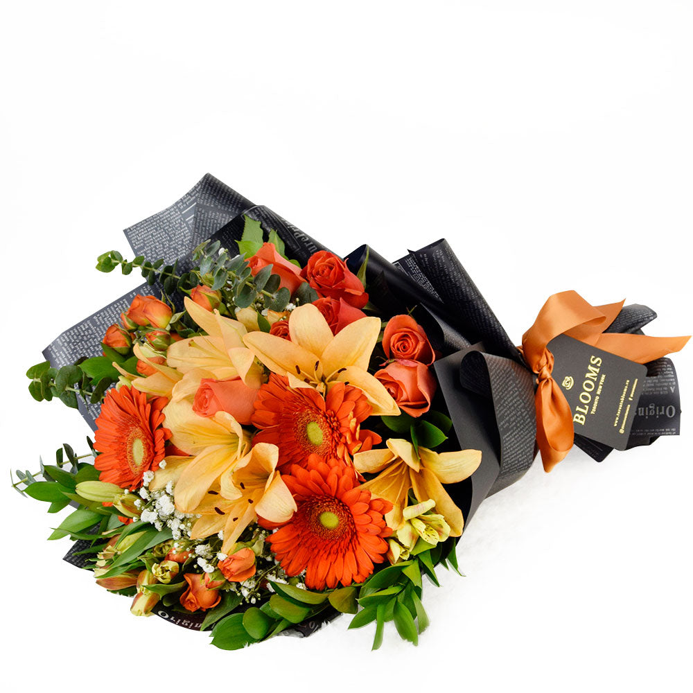 Mixed rose bouquet in red, yellow, and orange. Blooms America Delivery