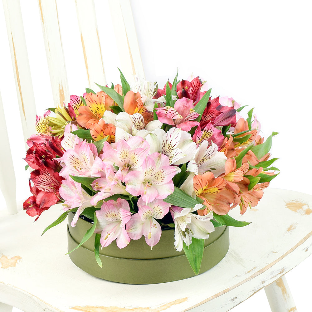 Gourmet Gift Featuring Lilies in a Short Green Hat Box – how the gift is presented