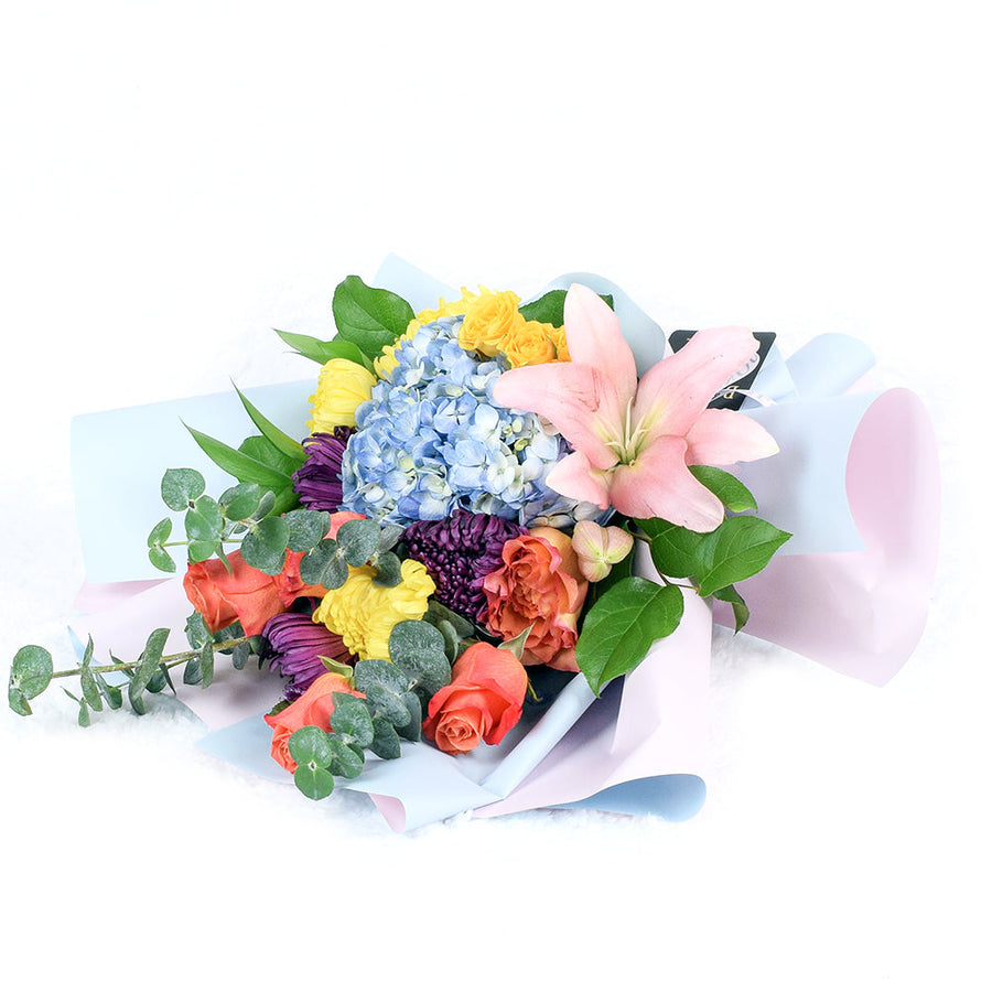 The Festive Purim Bouquet from America Blooms features a cheerful arrangement of roses, cremons and other flowers tied with a designer ribbon. America Blooms Delivery