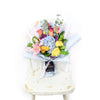 The Festive Purim Bouquet from Blooms America features a cheerful arrangement of roses, cremons and other flowers tied with a designer ribbon