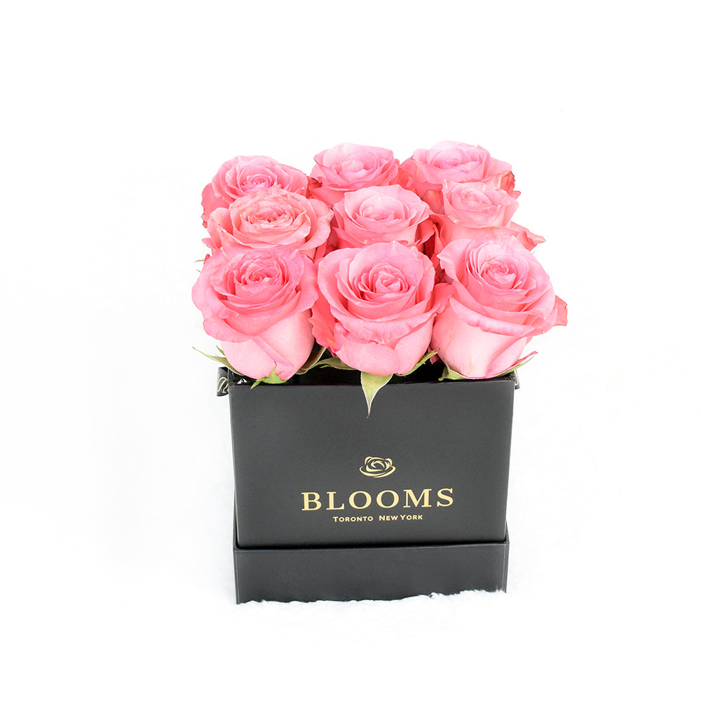 Impeccable pink rose hat box arrangement. America Delivery. 