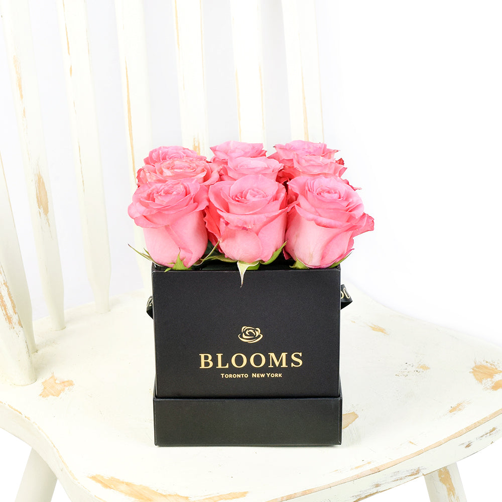 Impeccable pink rose hat box arrangement. America Delivery. 