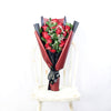 This bouquet includes a selection of deep red roses, baby’s breath, and ruscus gathered in floral wrap with designer ribbon. Blooms America Delivery