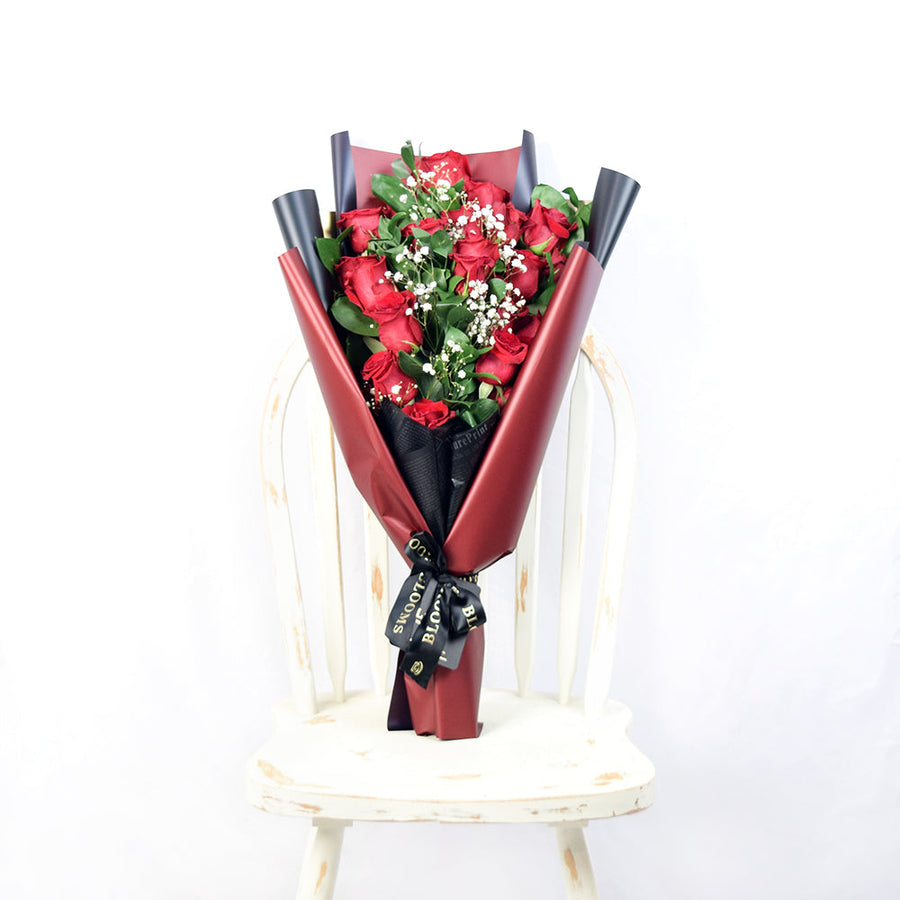 This bouquet includes a selection of deep red roses, baby’s breath, and ruscus gathered in floral wrap with designer ribbon. America Blooms- America Blooms Delivery