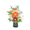 Brightly coloured mixed floral arrangement in a black box. America Blooms Delivery.