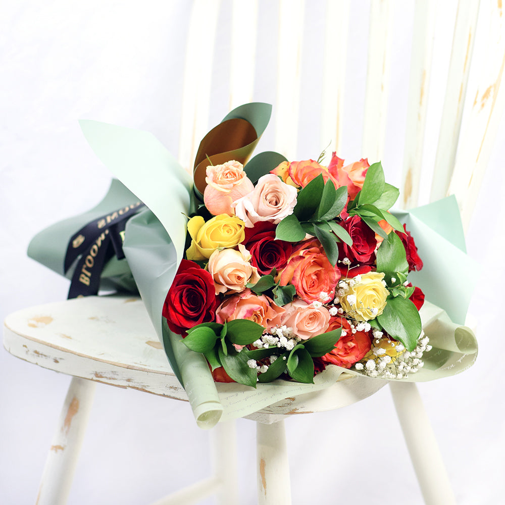 Rustic Arcadia Rose Bouquet, with red, orange and yellow roses. Baby's breath and ruscus from America Blooms - America Delivery.