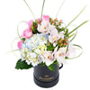 This gift highlights the beauty of hydrangeas, cymbidium orchids, roses, and more in a lovely hat box that makes a lovely centerpiece.  America Blooms Delivery